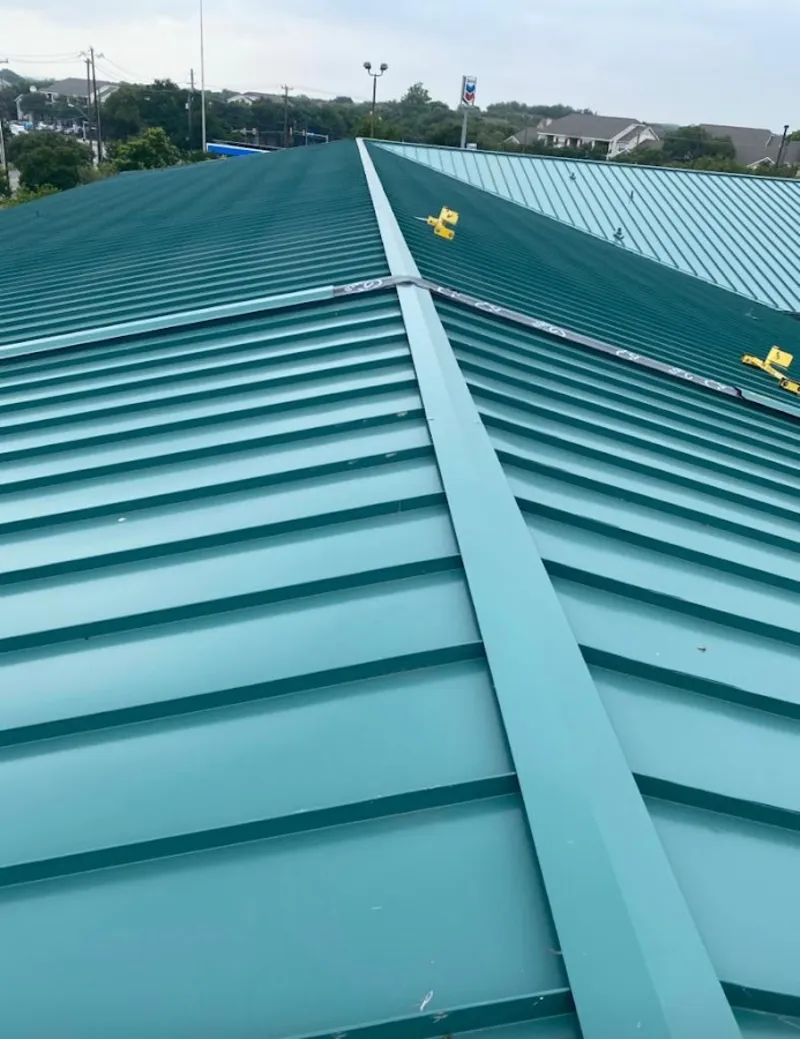 Green commercial metal roof ridge and valley for Metal Roof Repair in Caln